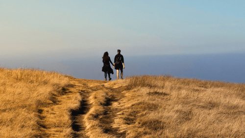 Happy couple on honeymoon walking